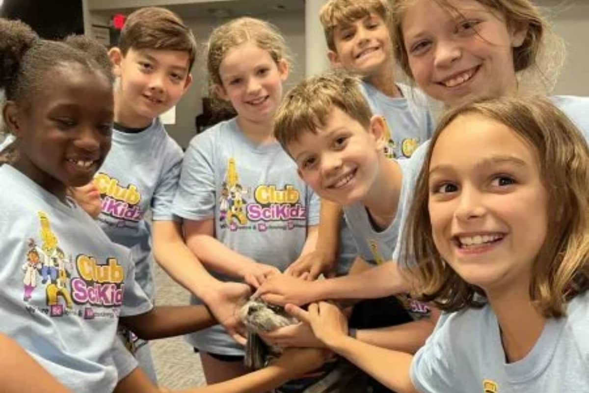 Kids touching a pet at Club SciKidz Central Indiana