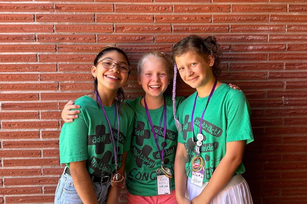 Girls hugging at Girls Rock Math