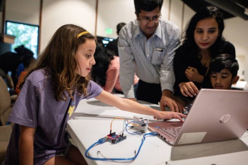Girl coding at Learn To Bot