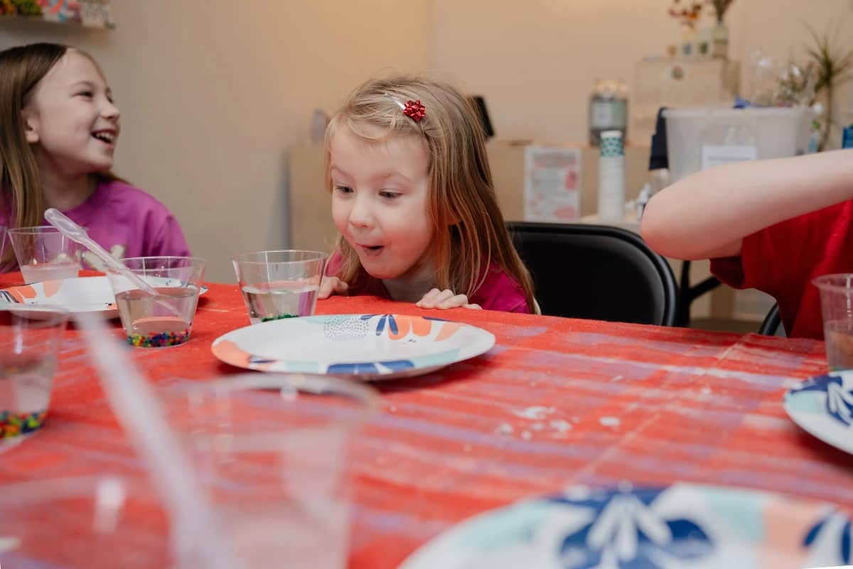 Girls doing science experiment at Science Guys of Baltimore camp